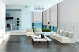 Luxury living room interior with white couch and seascape view